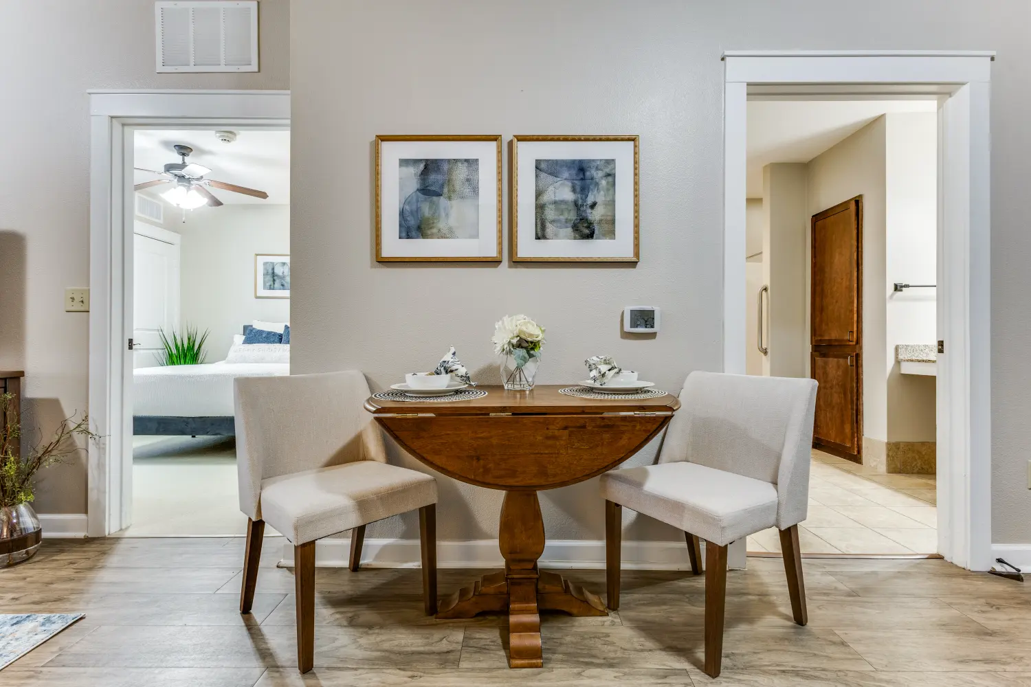 Senior living apartment dining area with table and chairs at The Ivy of McKinney assisted living community Texas