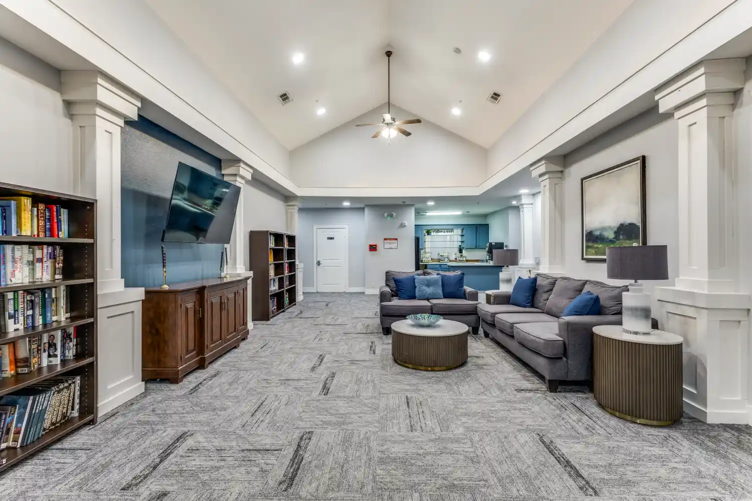 Senior living community lounge and library at The Ivy of McKinney Texas