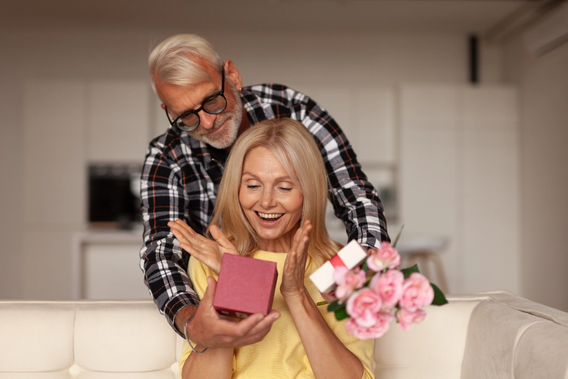 Seniors Couple Giving Valentines Day Gifts